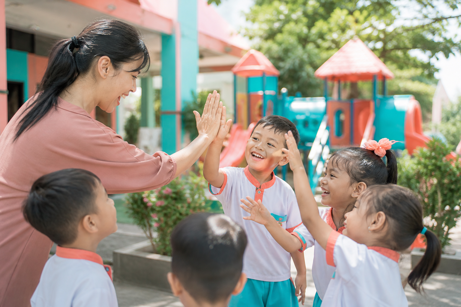 Teacher and children high five
